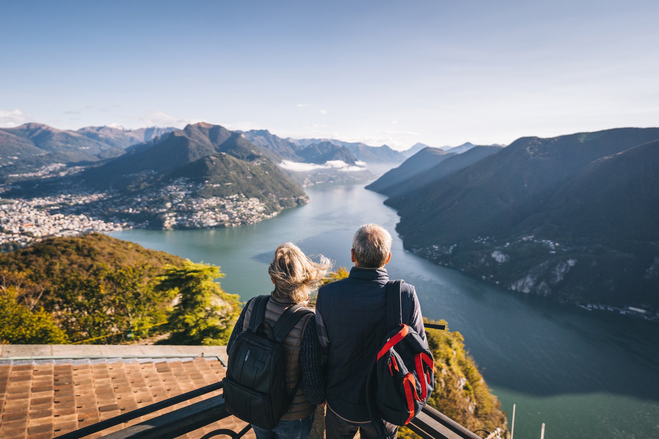  Older couple looking over water and mountains